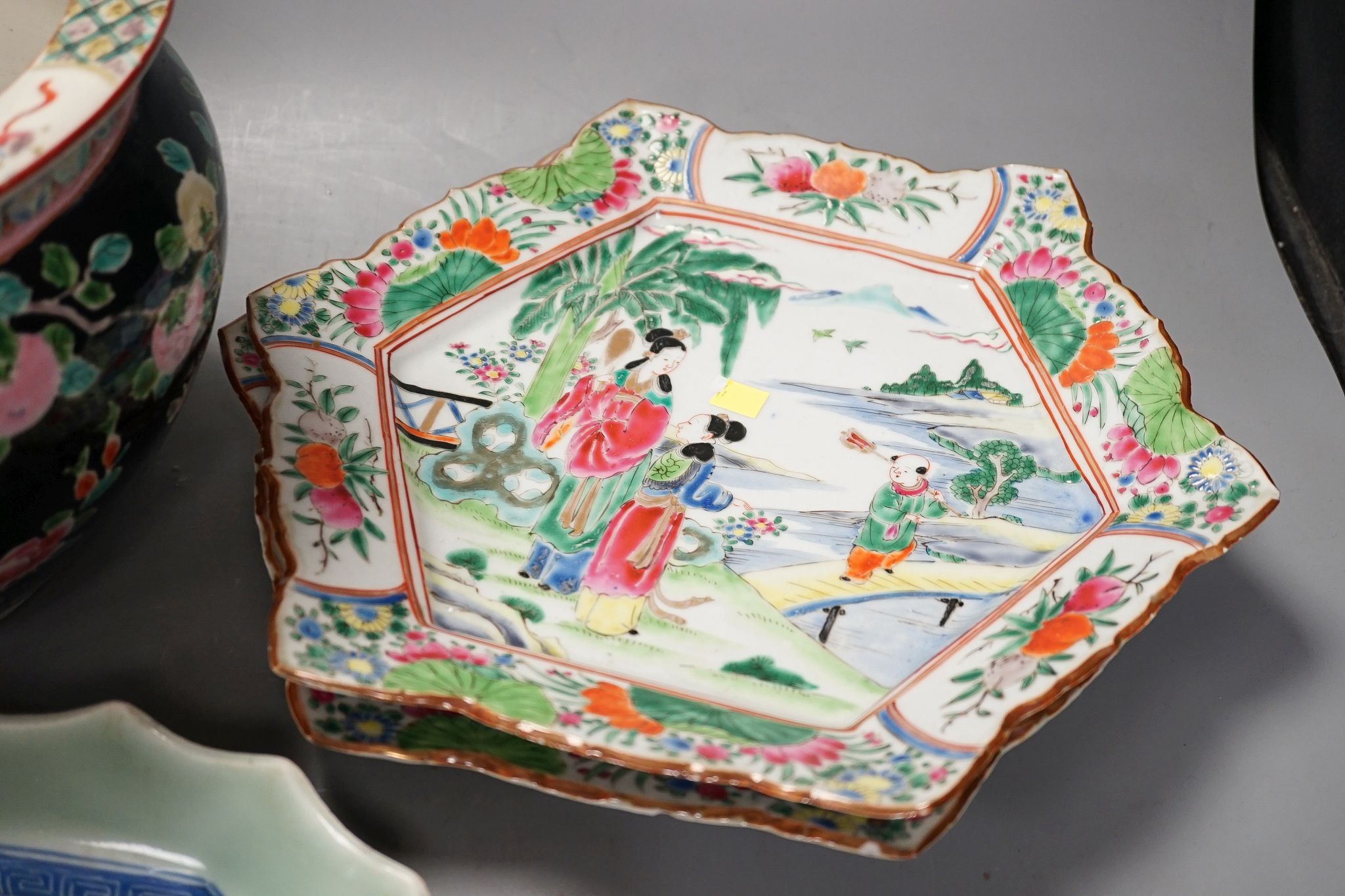 Three late 19th century Japanese porcelain dishes and a jardiniere, 19 cms high.